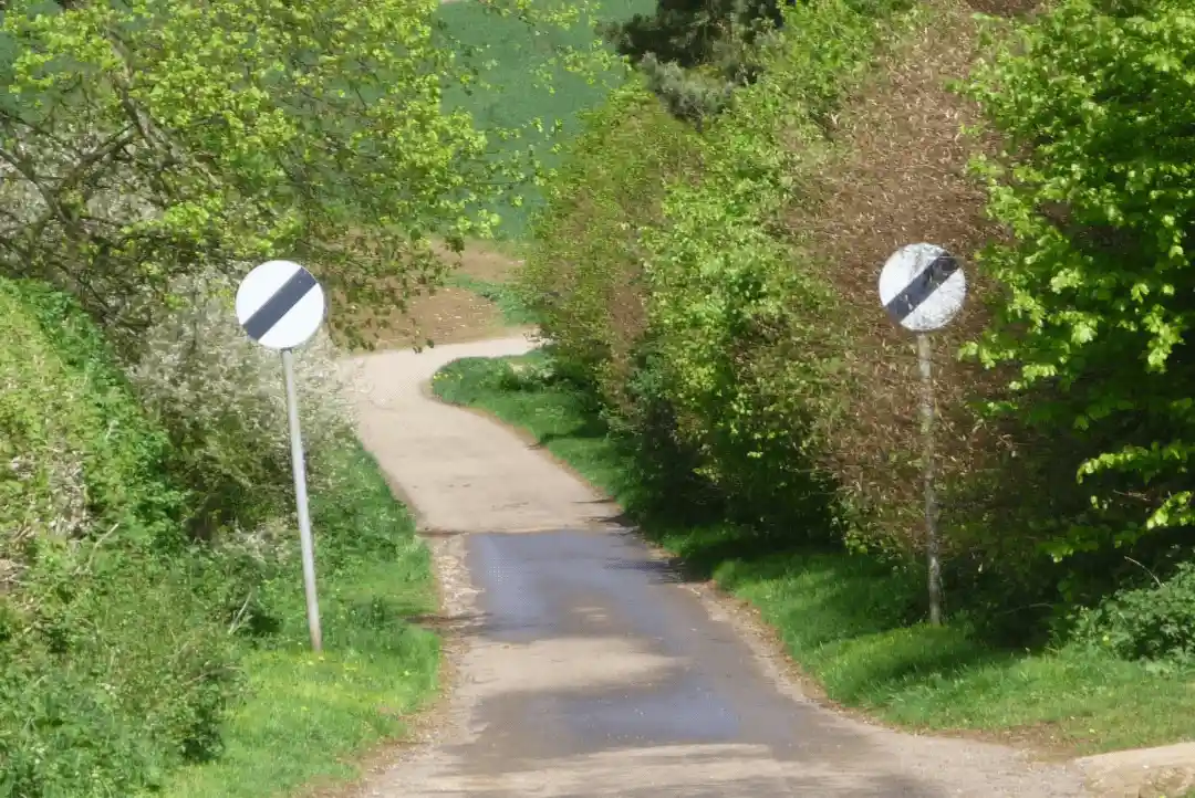 Single-track rural road at national speed limit — typical country lane hazards for new drivers
